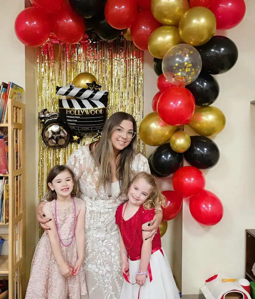 Teacher and students taking a photo at day care party